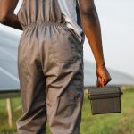 close-up-of-technician-with-tools-standing-on-solar